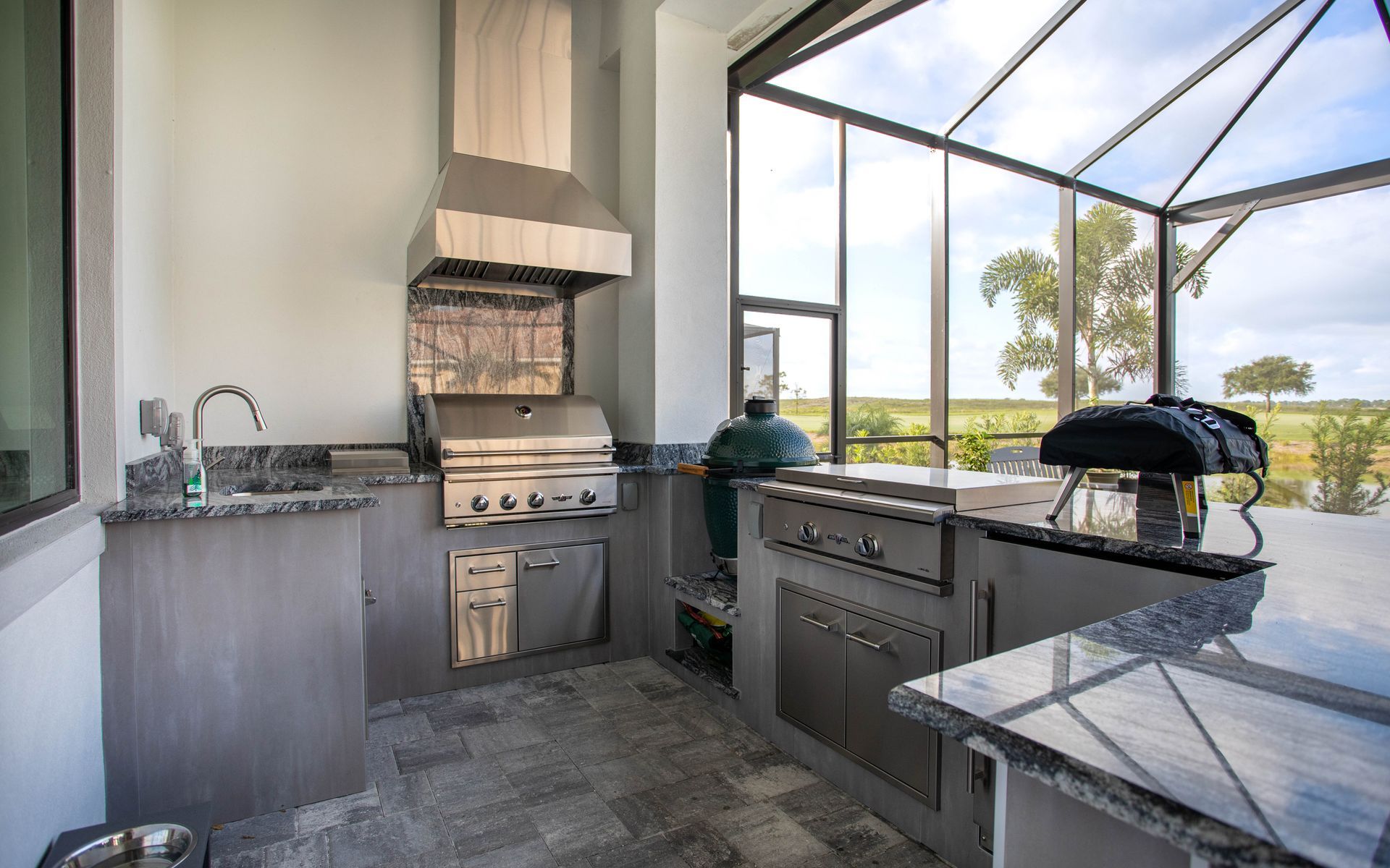 J shape outdoor kitchen, delta heat grill, modern, granite countertop, big green egg, Valencia Trails Naples