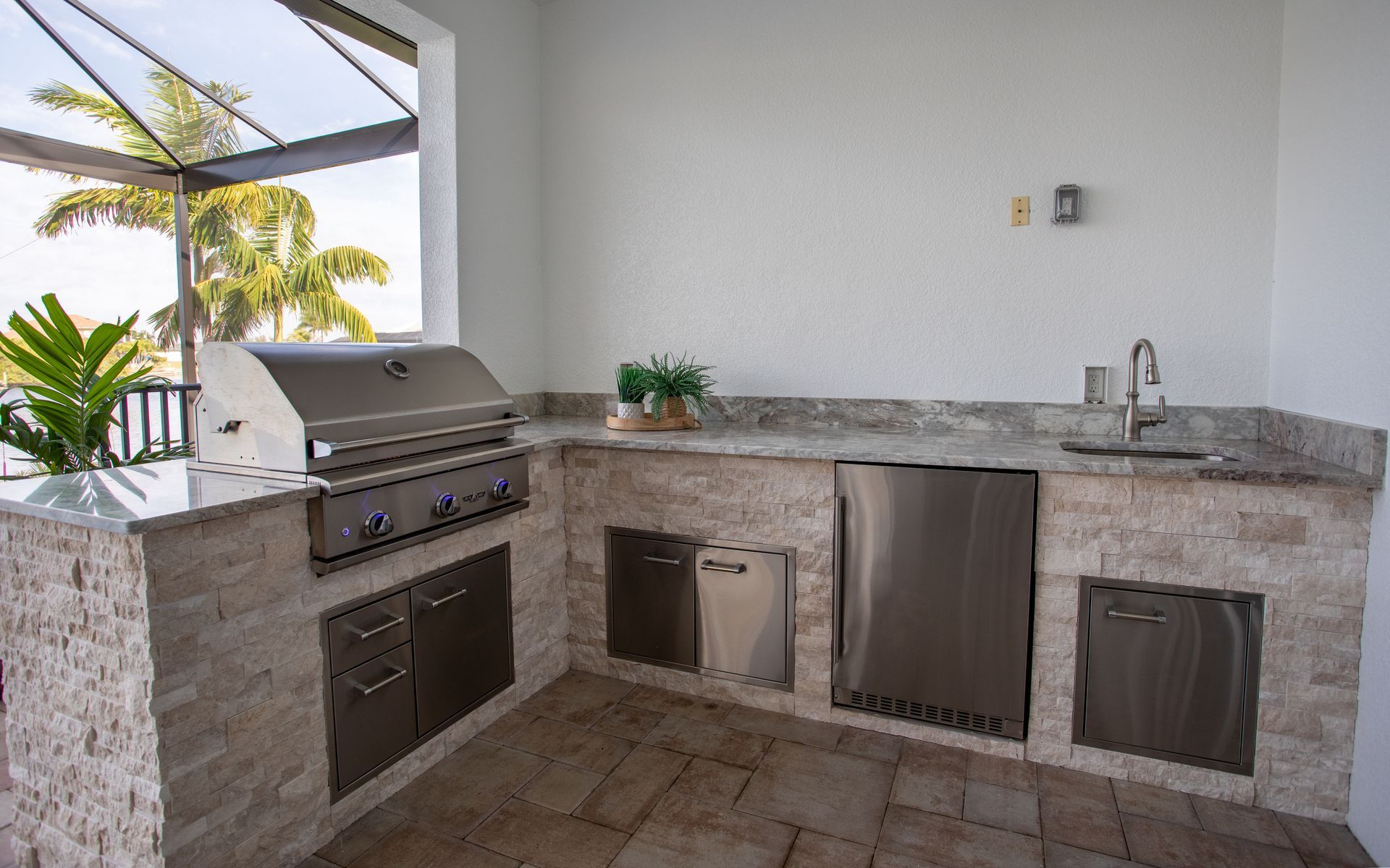 Stacked stone L Shape Outdoor Kitchen, Granite countertop, beige colors