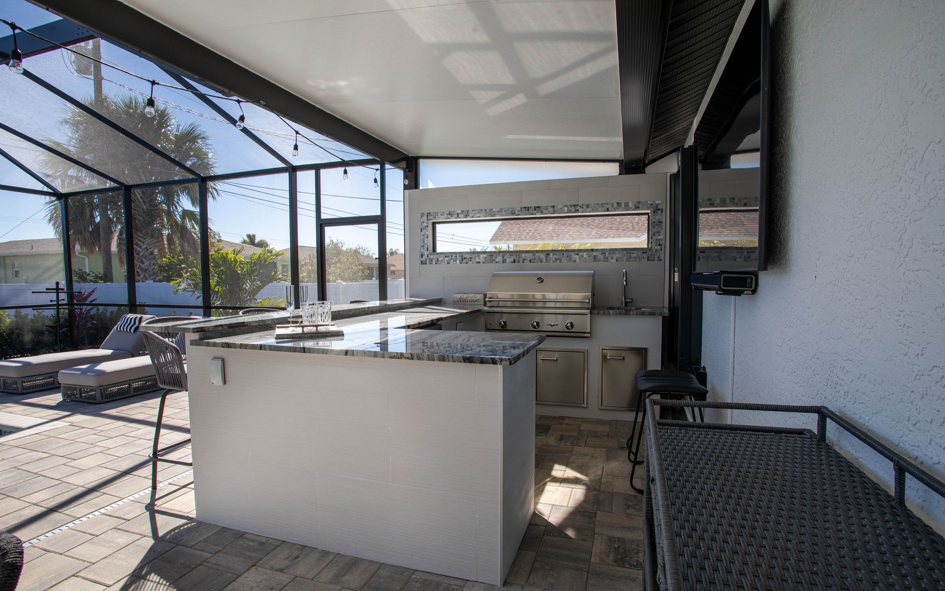 U shape outdoor kitchen, White with blue accents, granite countertop, sleek, modern, custom design, Punta Gorda