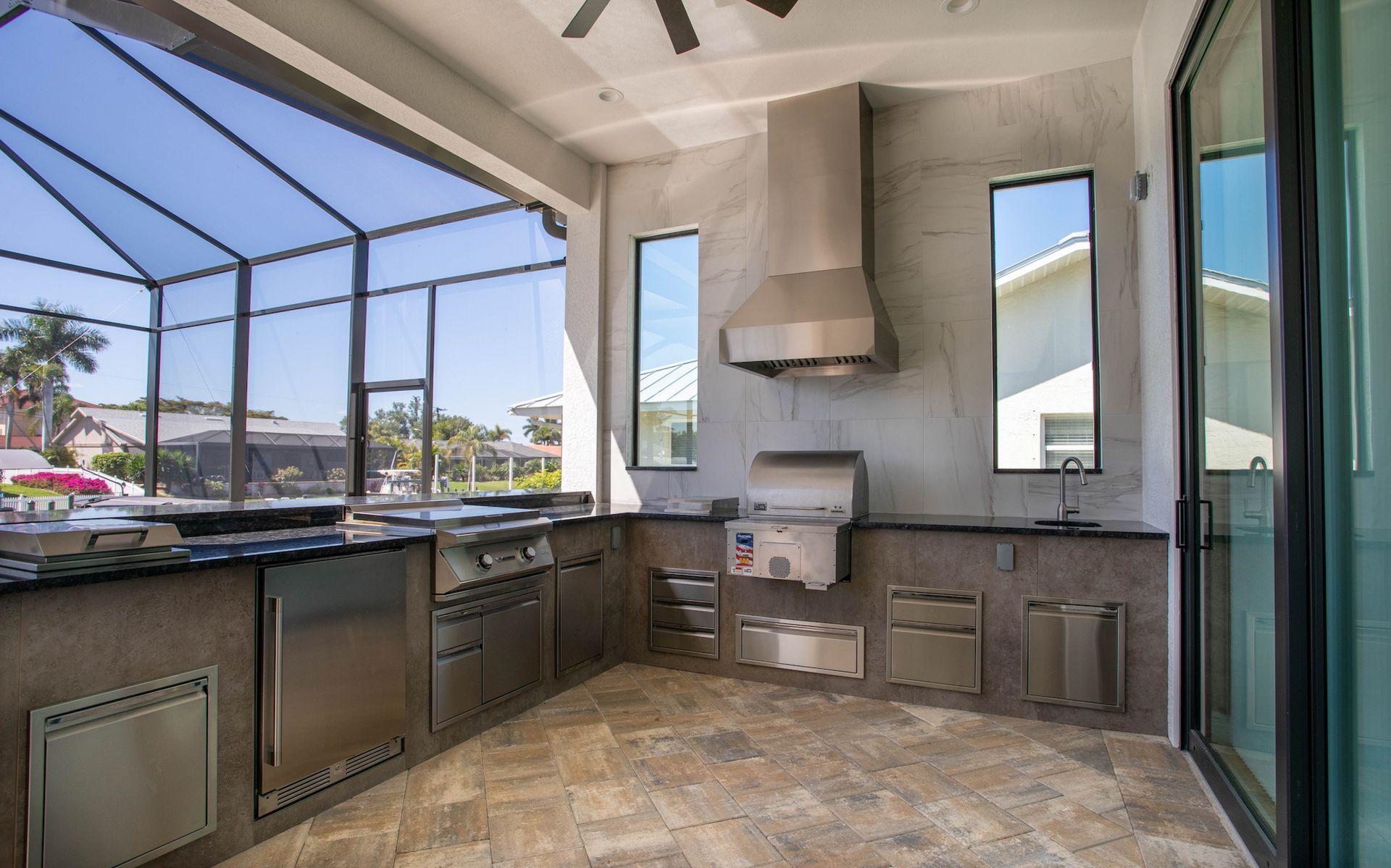 L Shape Outdoor Kitchen, Tile backsplash, black granite, hood, Estero FL