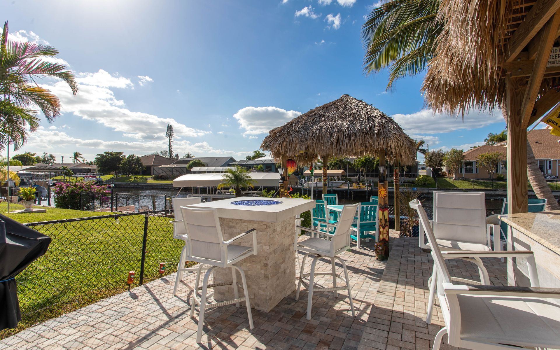 Bar height fire pit, Tan stacked stone, Seating , Cape Coral FL