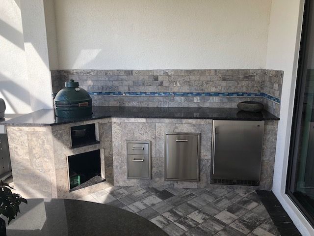 Big Green Egg silver travertine tile outdoor kitchen Bonita Springs FL
