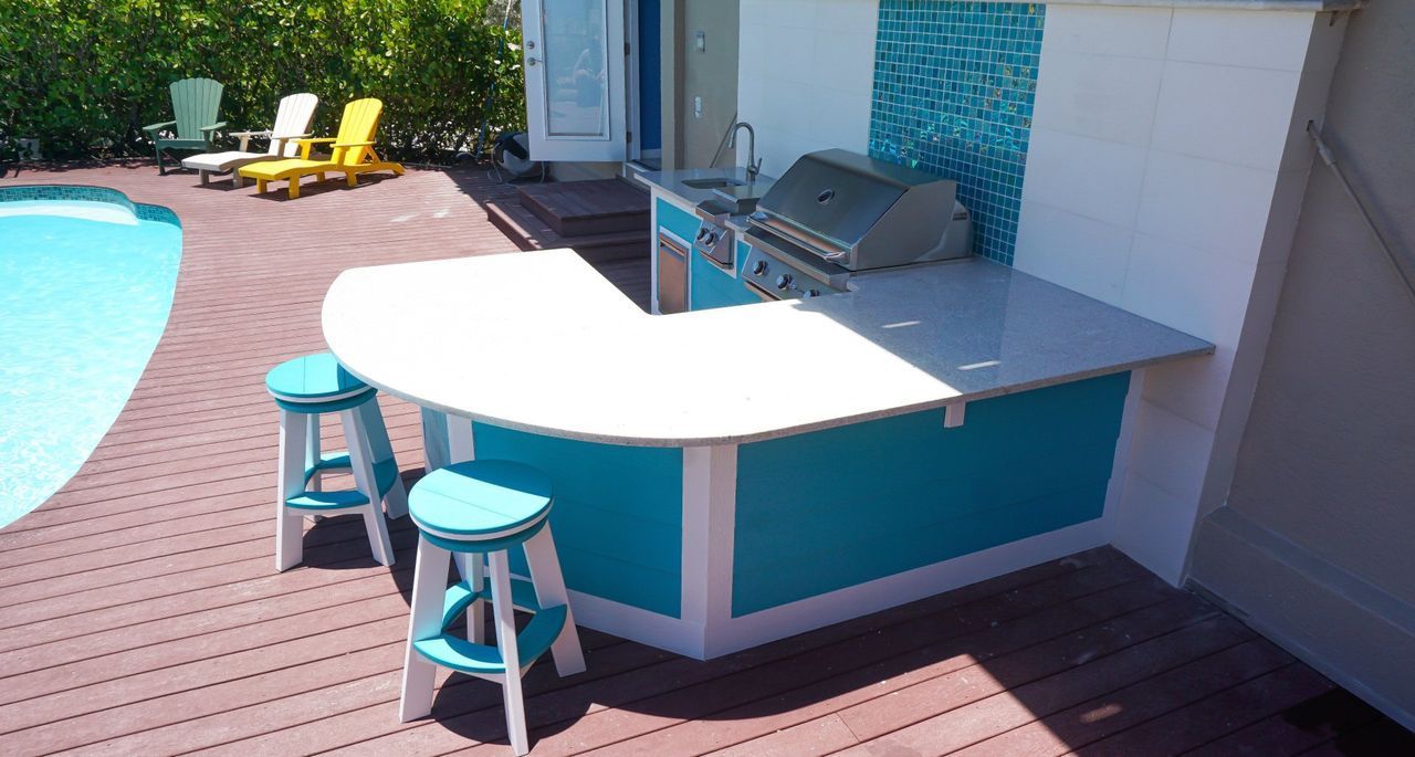 Bright Blue and white hardie siding outdoor kitchen with twin eagles grill sanibel island, fl