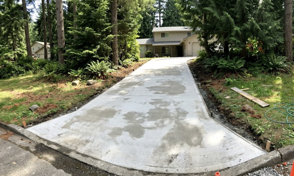 A freshly poured, durable concrete driveway installed by expert contractors in Spokane WA.