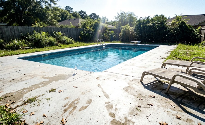Custom concrete pool deck providing a safe and beautiful outdoor living space.