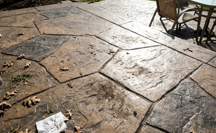 Decorative stamped concrete patio designed to look like natural stone.