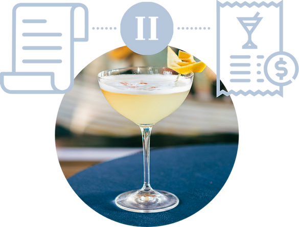 A martini glass with a lemon slice on top of it