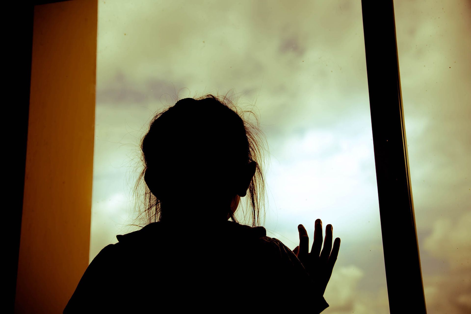 child looking out window