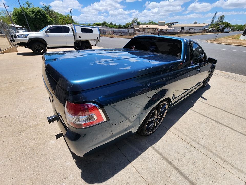 A blue pickup truck is parked on the side of the road — Ace Tinting in Mareeba, QLD