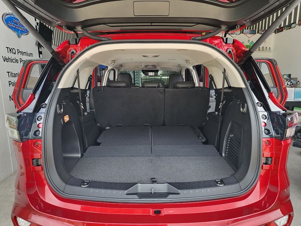 The back of a red car with the trunk open — Ace Tinting in Mareeba, QLD