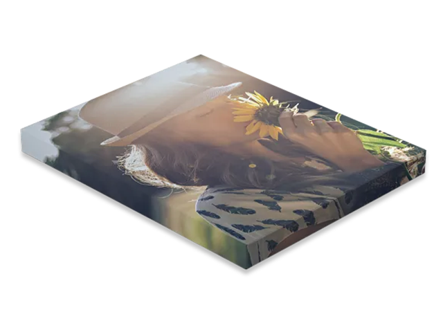 a canvas with a picture of a woman with a sunflower .