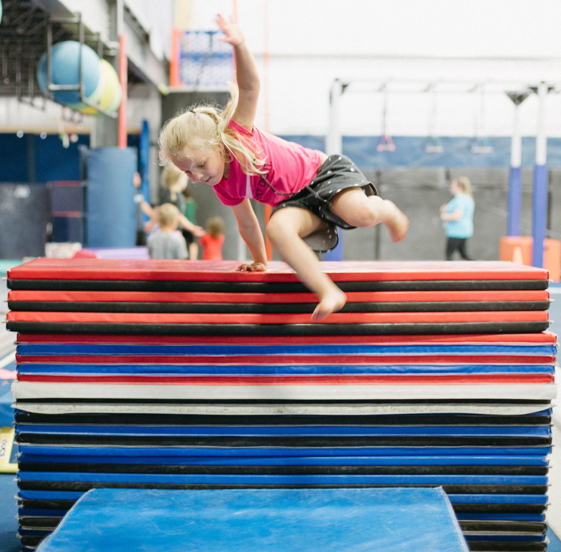 Child playing on gym equipment
