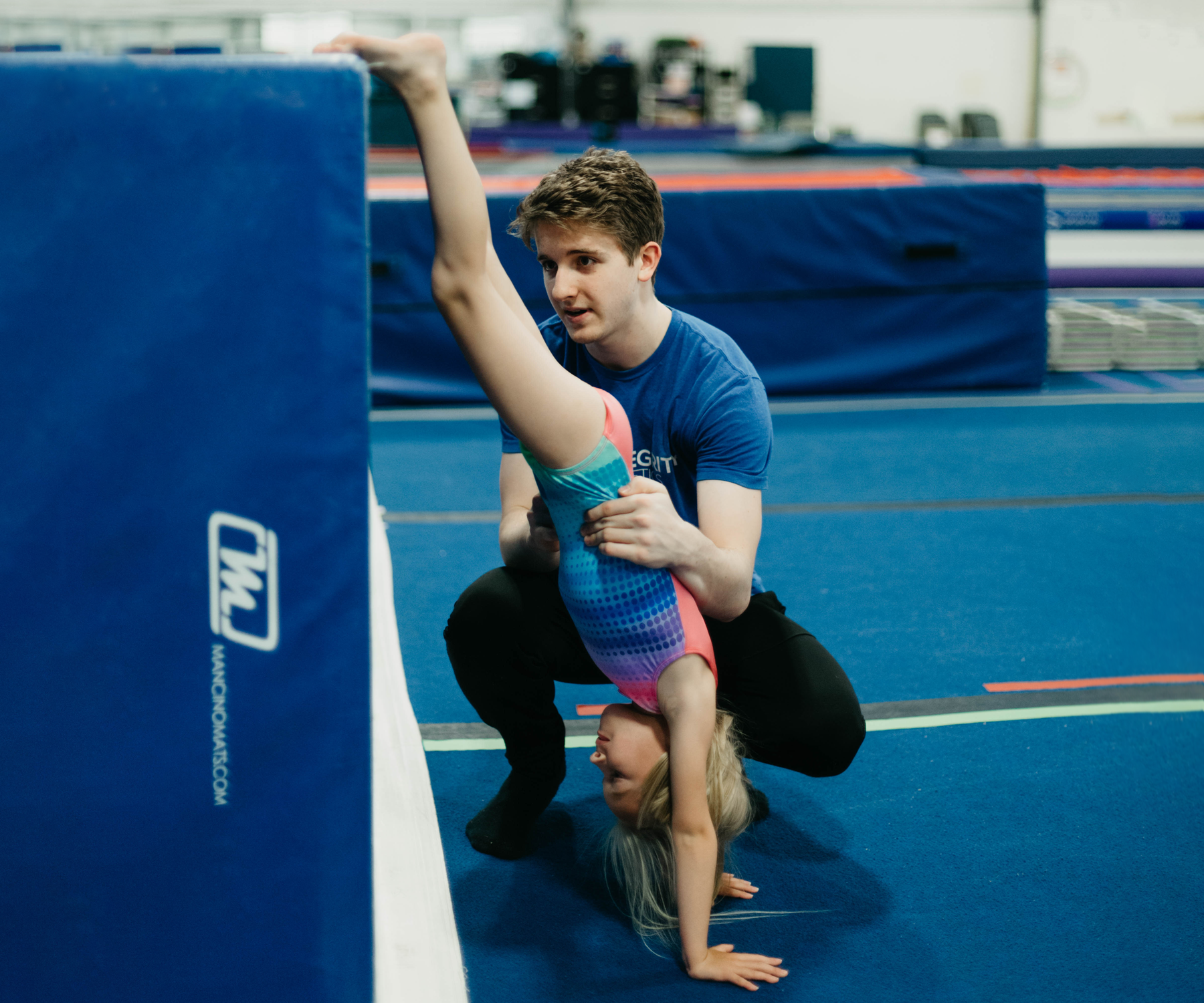 A group of children are playing in a gym