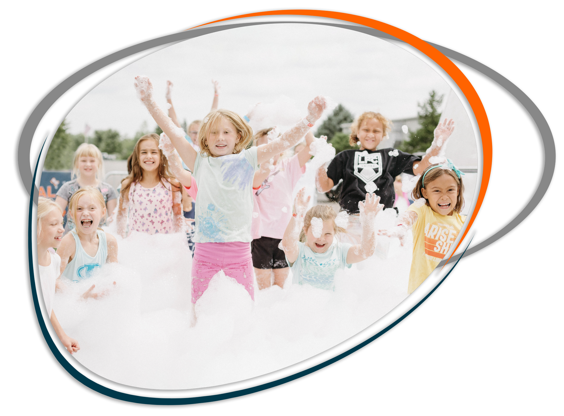 A group of children are jumping in the air while playing with foam.