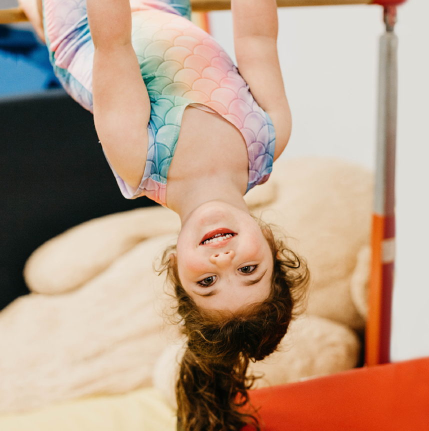 Child playing on gym equipment