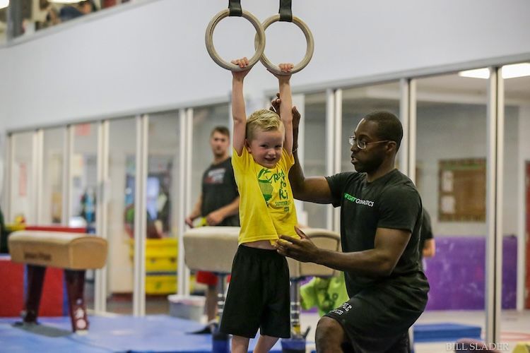 Child playing on gym equipment