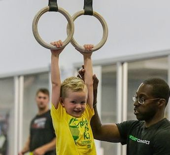 Child playing on gym equipment