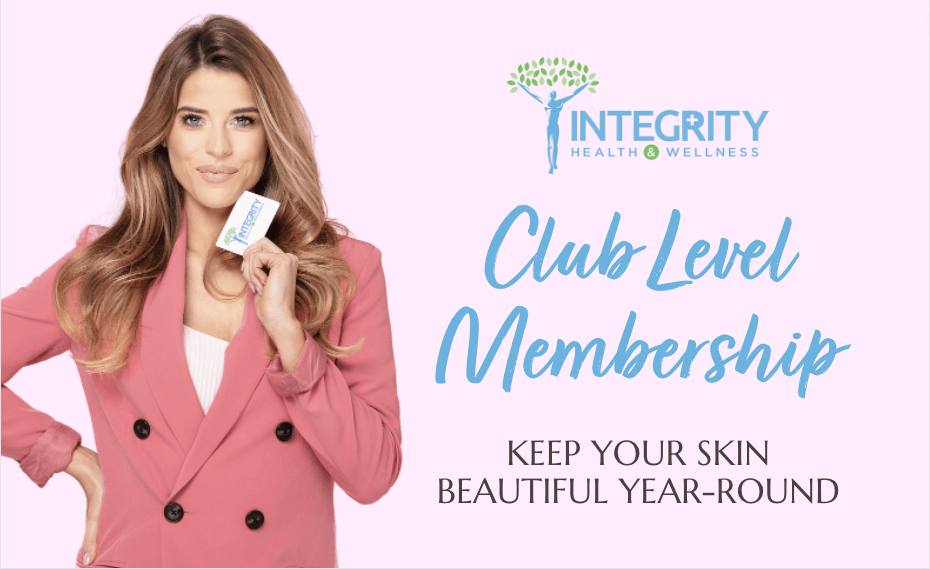 A woman in a pink jacket is holding a club level membership card.