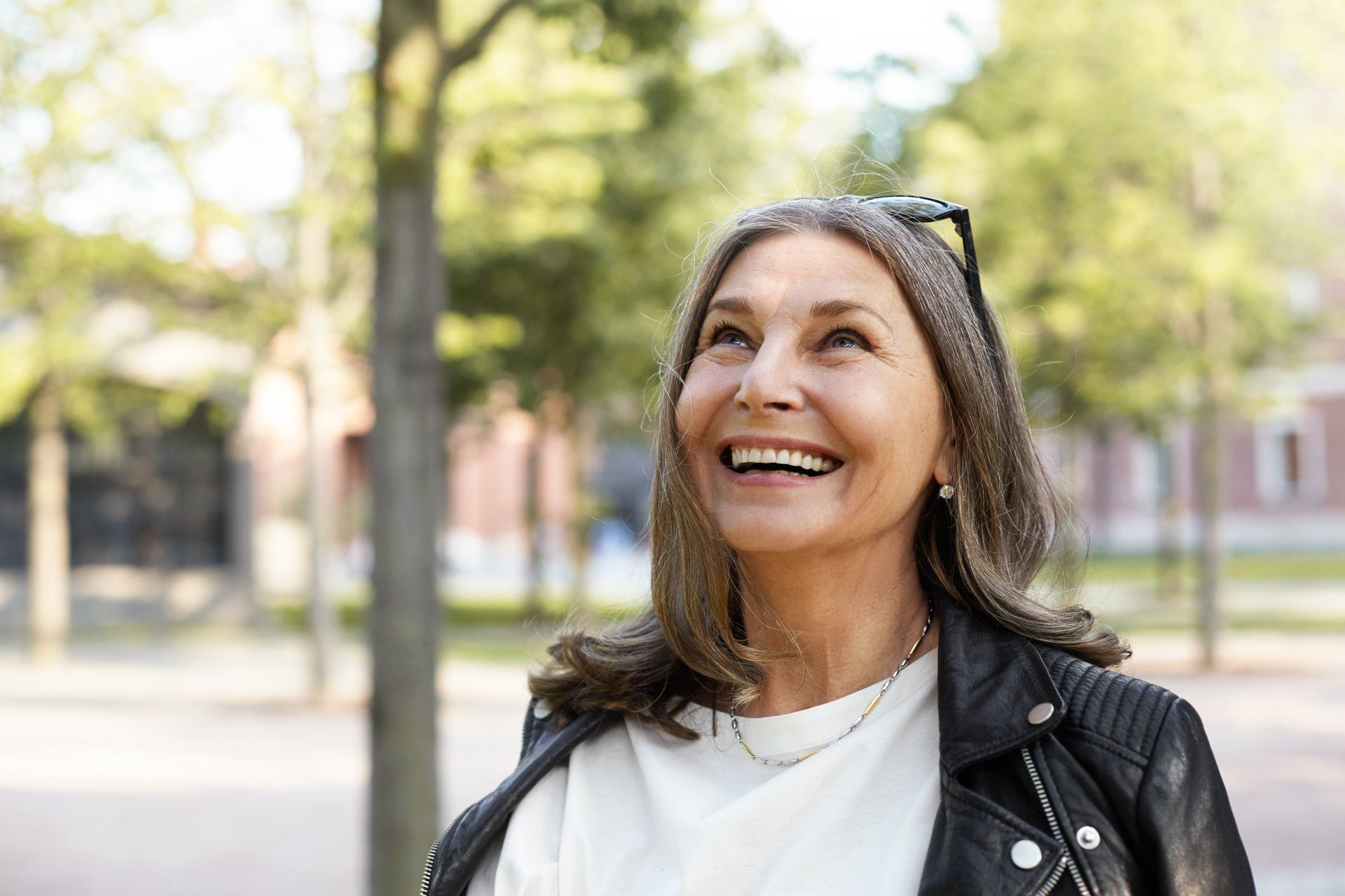 happy mature woman on city street