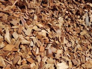 A Pile of Wood Chips Is Sitting on The Ground — Cooroy Landscape Supplies and Garden Centre in Cooroy, QLD