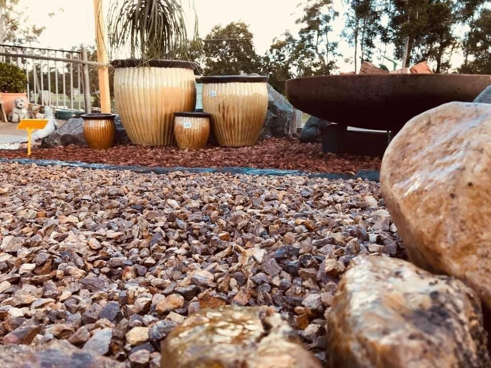 A Group of Pots Sitting on Top of A Pile of Gravel — Cooroy Landscape Supplies and Garden Centre in Cooroy, QLD