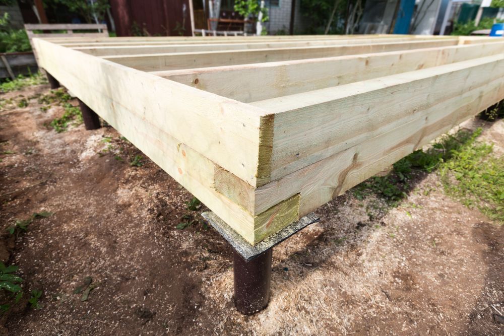 Raised Wooden Planter Bed on Posts in a Dirt Yard, With Pale Wood Boards — Ground Screws SEQ Pty Ltd In Meridan Plains, QLD