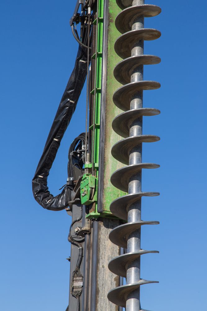 Close-up Of a Utility Pole With Mounted Cable Hardware and a Row — Ground Screws SEQ Pty Ltd In Meridan Plains, QLD