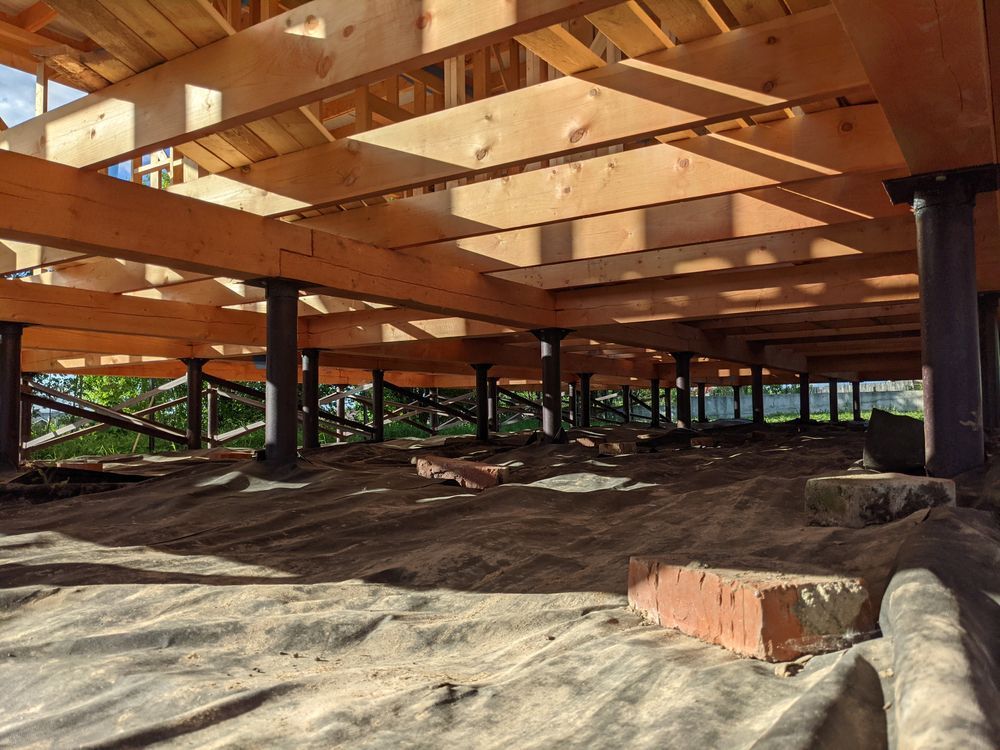 Elevated Wooden Building Under Construction With Exposed Beams — Ground Screws SEQ Pty Ltd In Meridan Plains, QLD