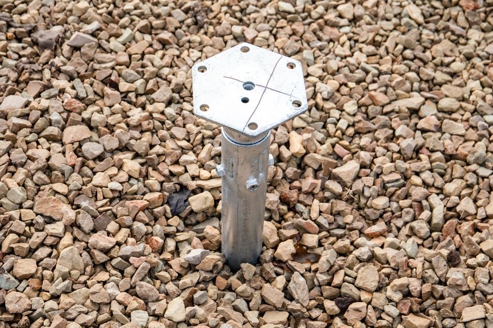 Metal Survey Marker in Gravel, With a Hexagonal Top Plate — Ground Screws SEQ Pty Ltd In Meridan Plains, QLD