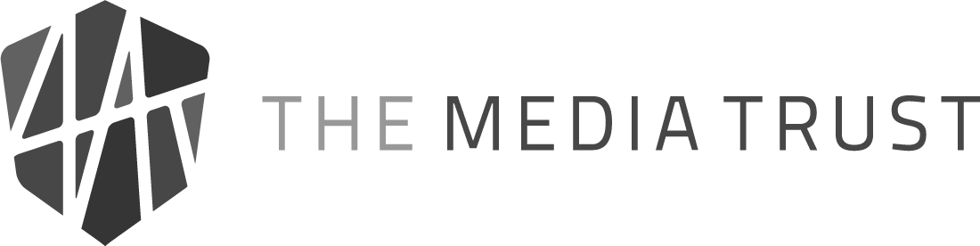 The Media Trust logo with stylized gray geometric emblem and text on a white background