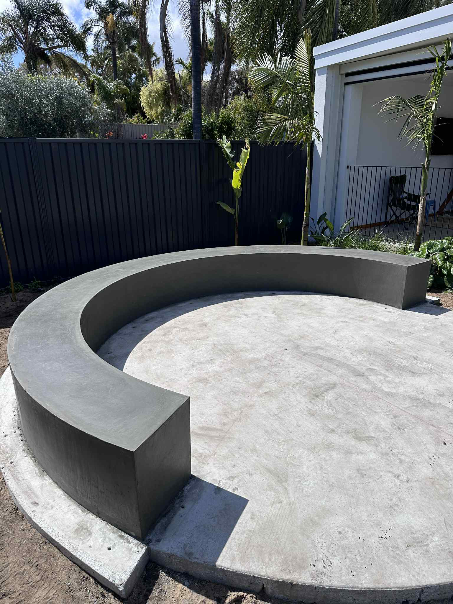 Architectural concrete bench for fireplace installation in Perth home renovation.