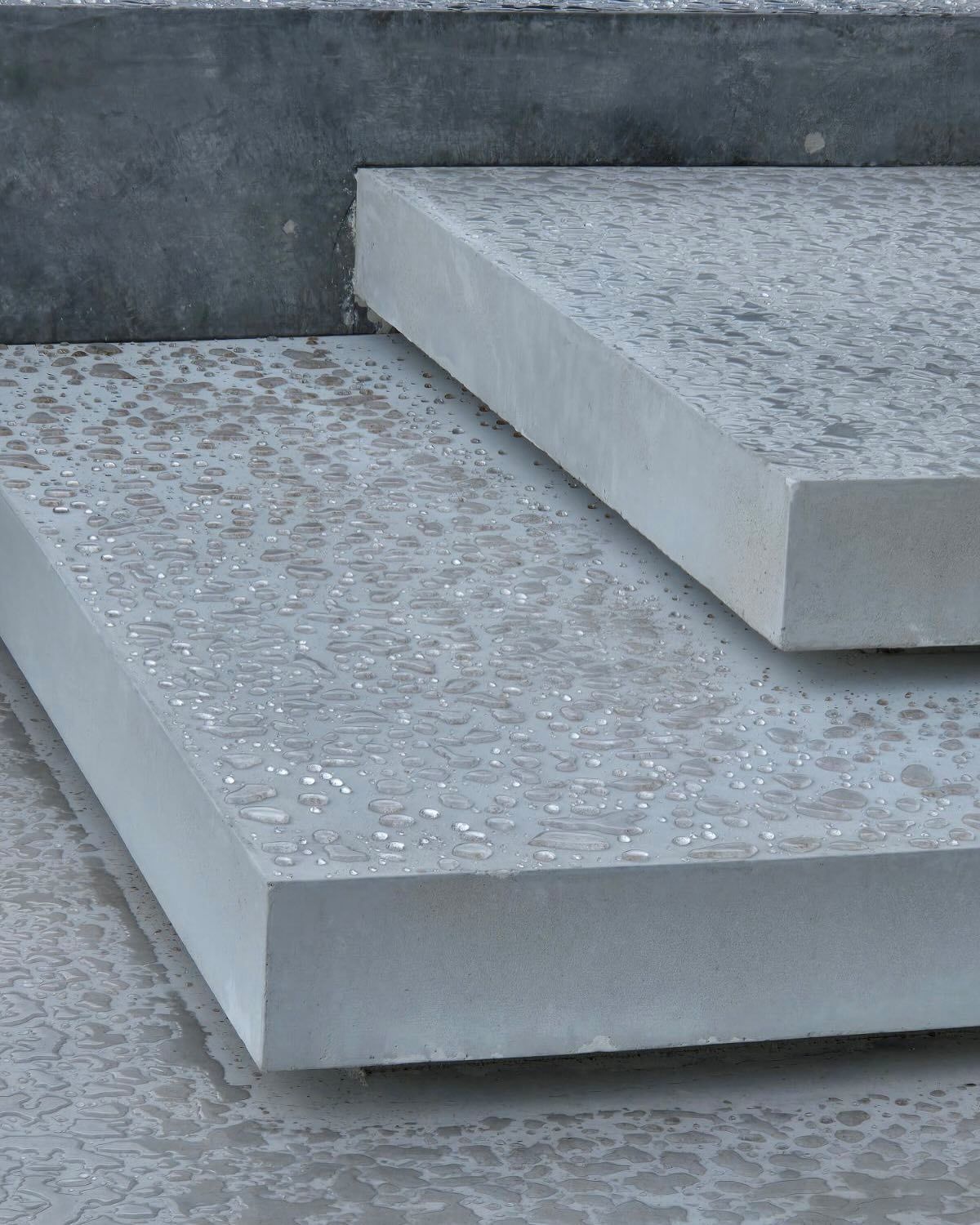 Up close of floating concrete steps for home entrance