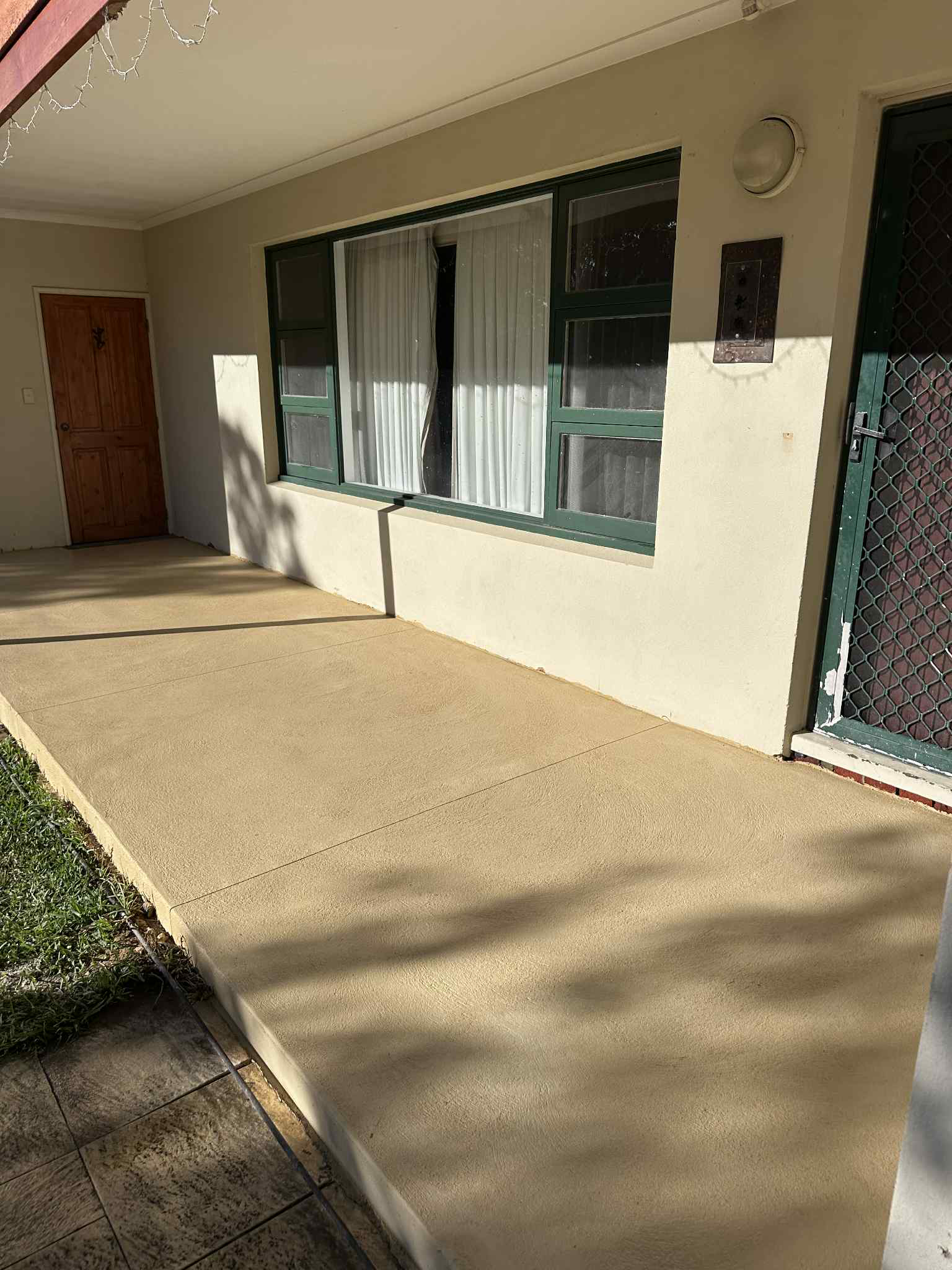 Liquid limestone alfresco area at the front entrance of house.