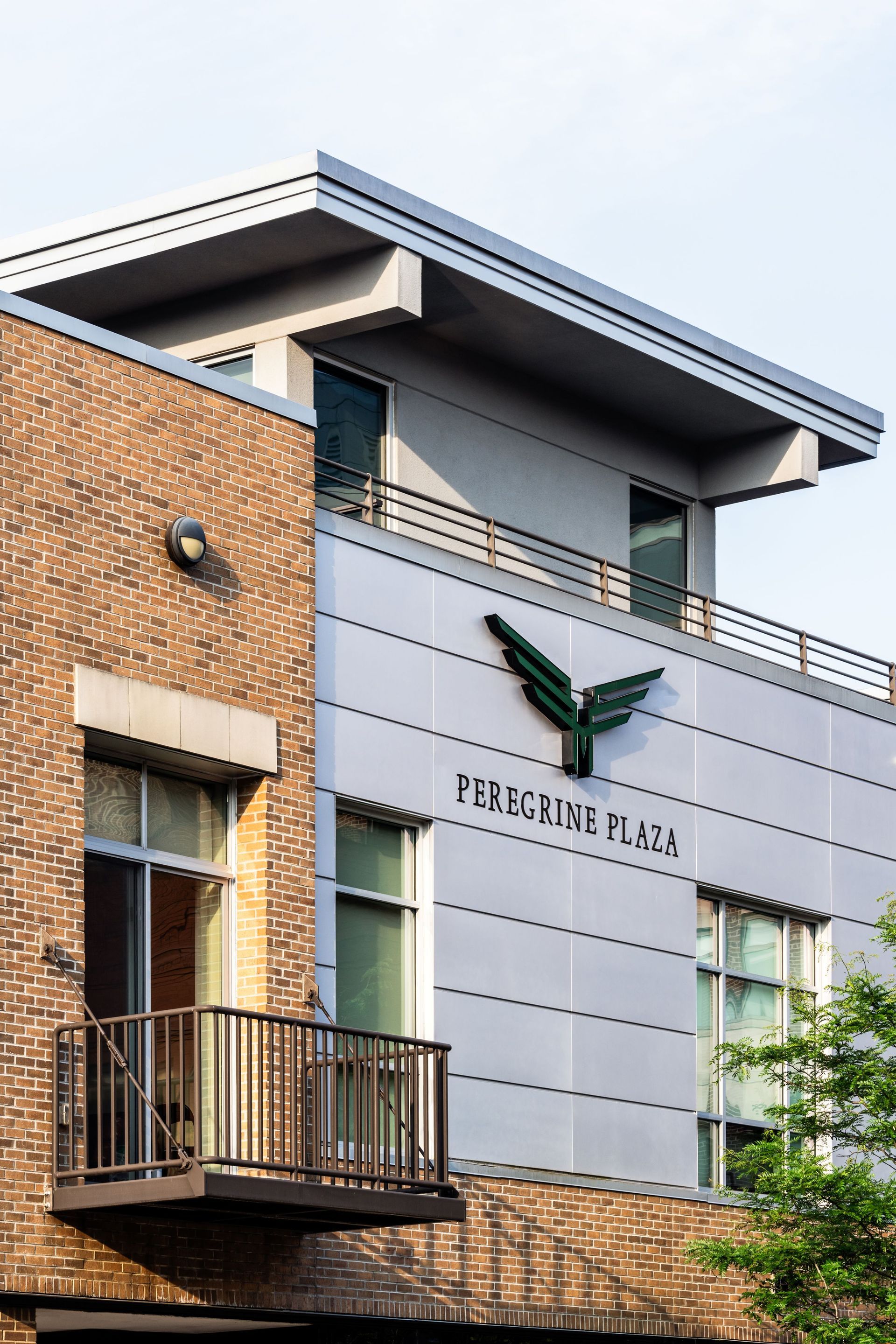 A brick building with a balcony on the side of it