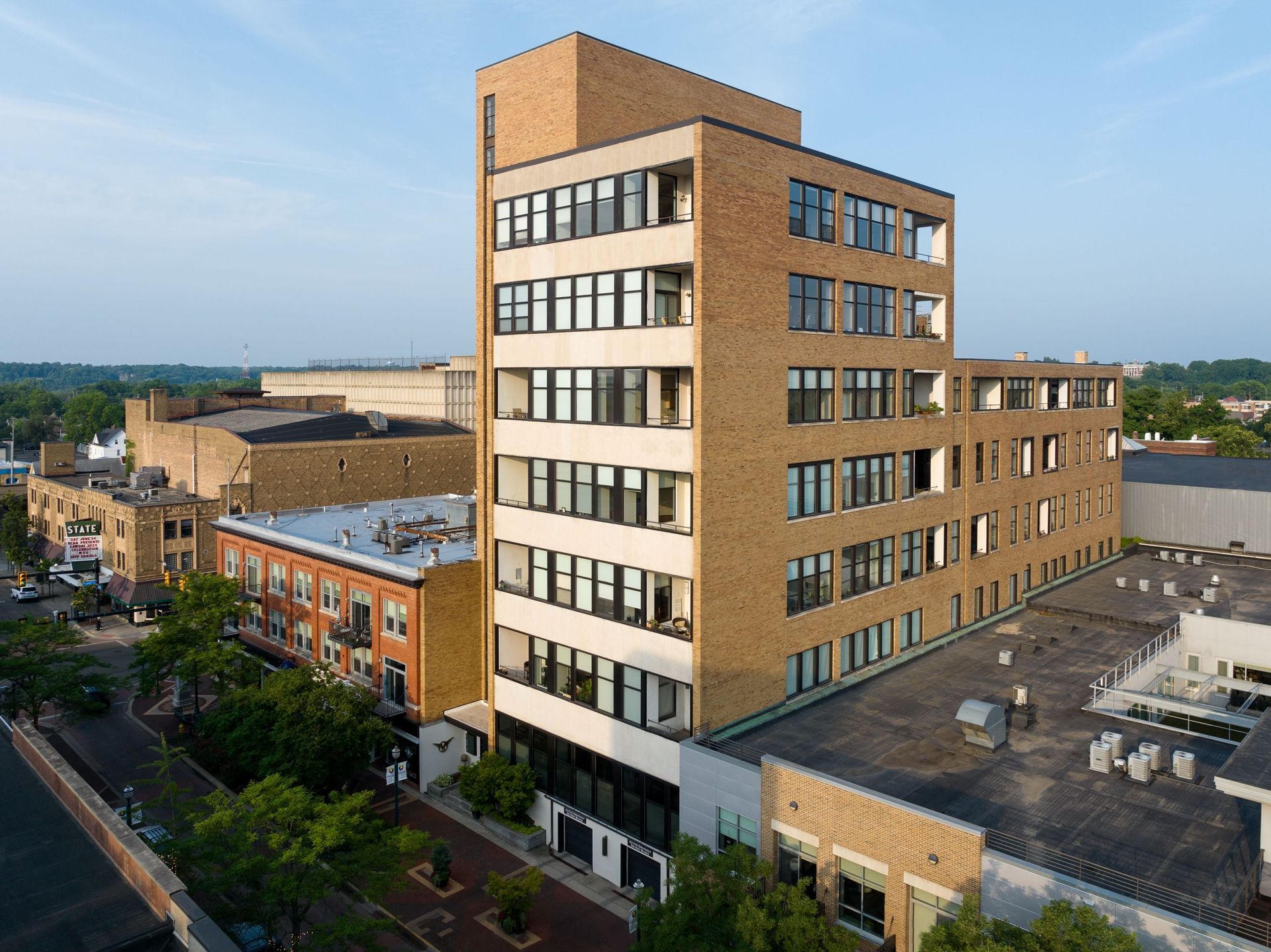 An aerial view of a large brick building with lots of windows