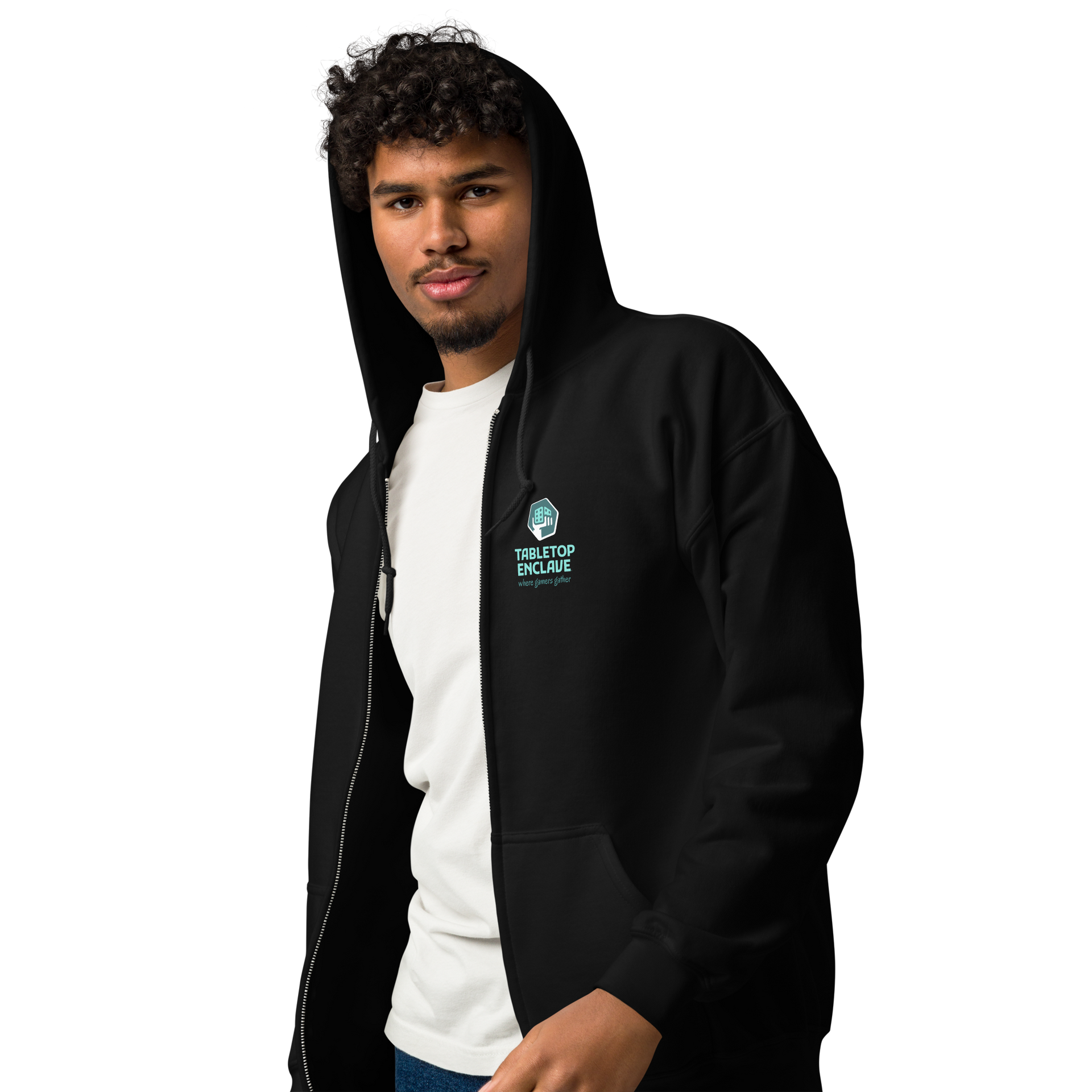 Man wearing black zip-up hoodie with small logo on the chest; looks toward the camera.