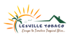 Lesville Tobaco logo with orange sun, green palm, and tagline “Escape to Timeless Tropical Bliss.”