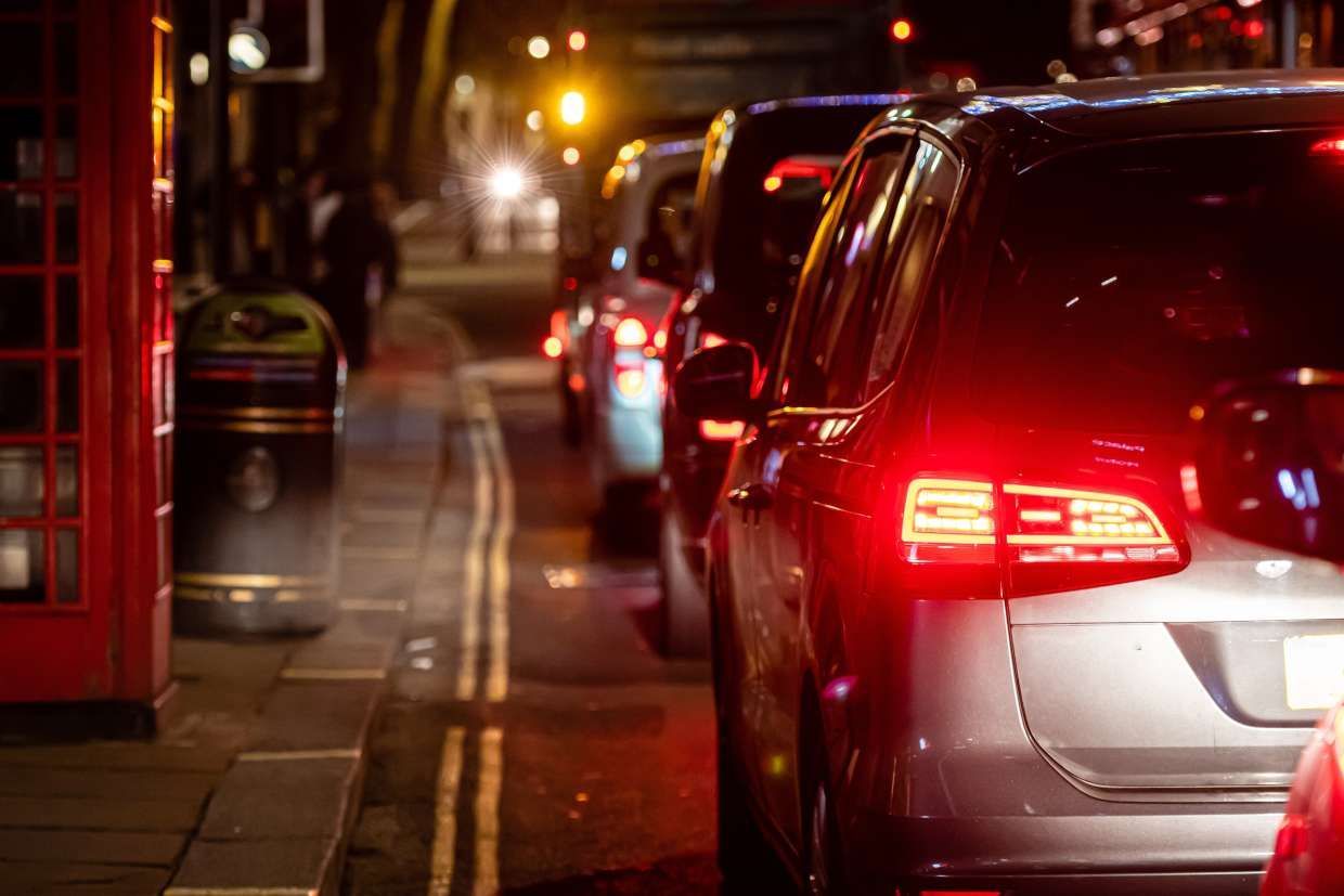 cars in traffic in the evening