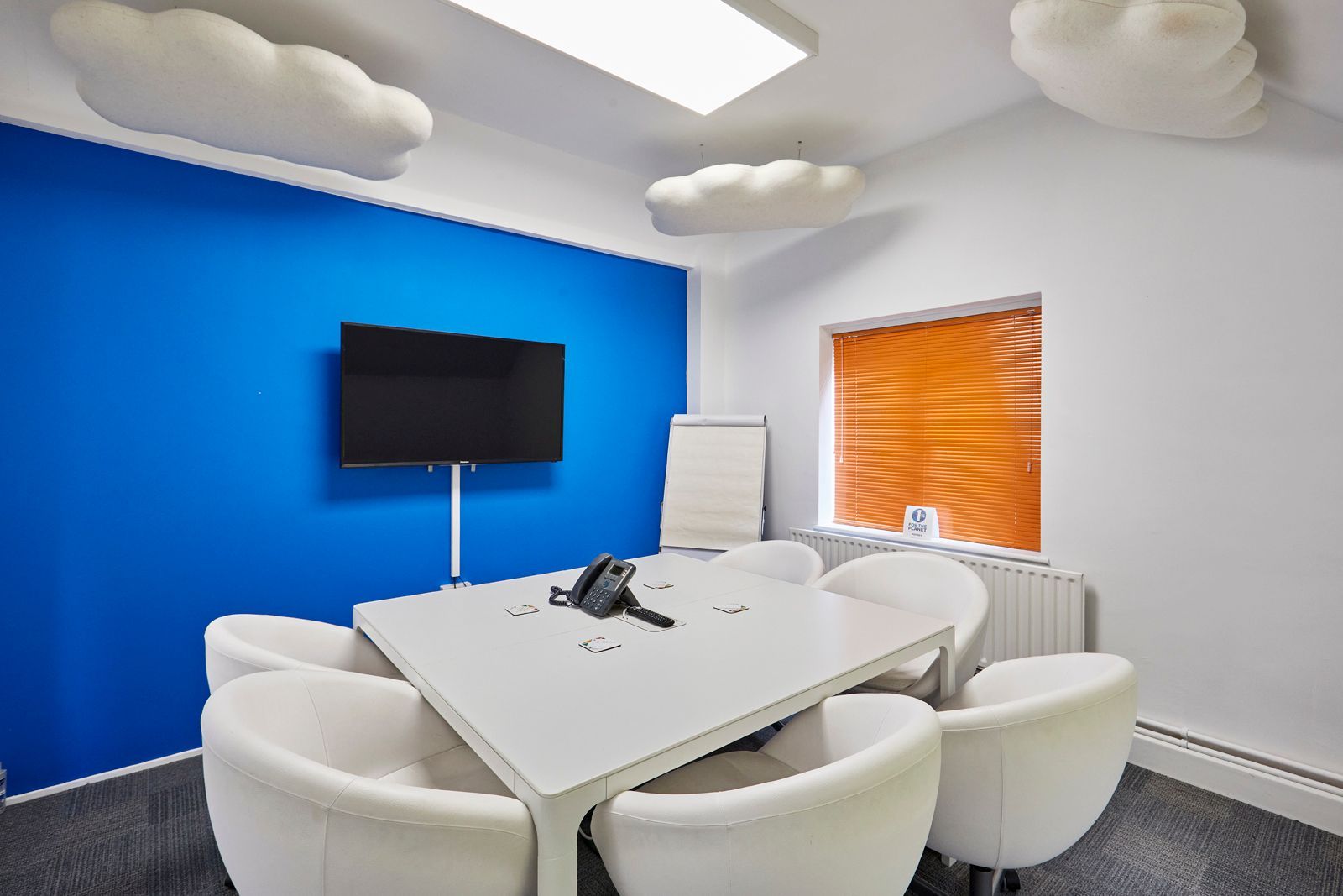Meeting room with tv and cosy seating at Tanshire Business Park