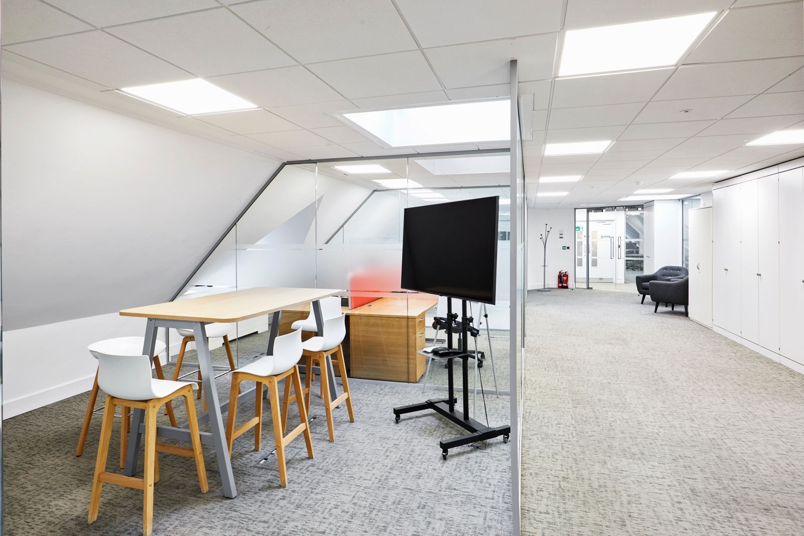 Meeting room with high tables and TV at Tanshire Business Park