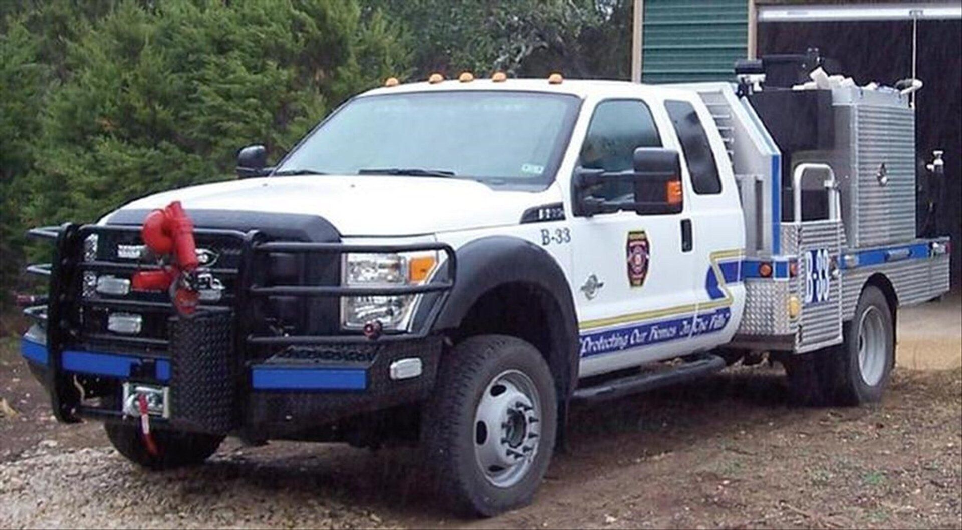 A white and blue Bergheim VFD fire truck.