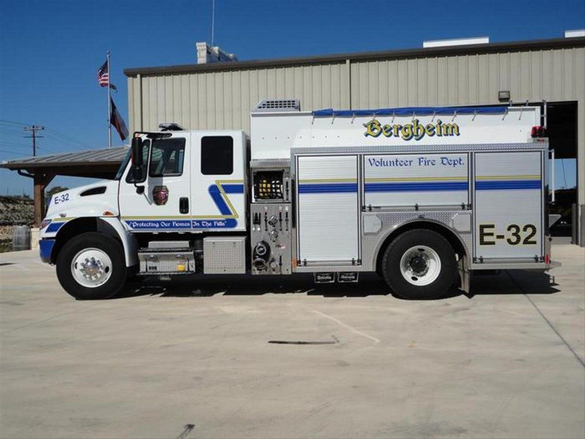 A Bergheim fire truck is parked in front of a fire station