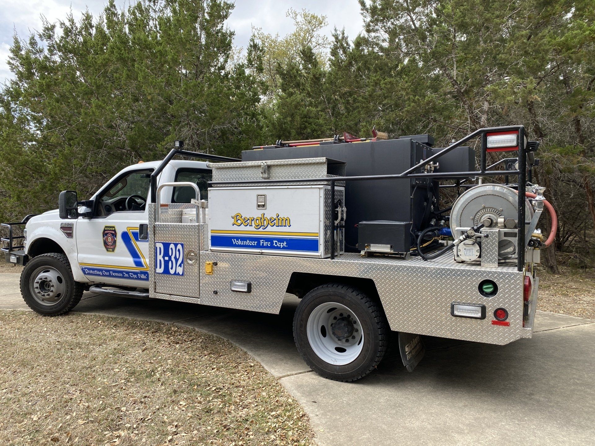 A white and blue Bergheim VFD fire truck is parked on the side of the road.