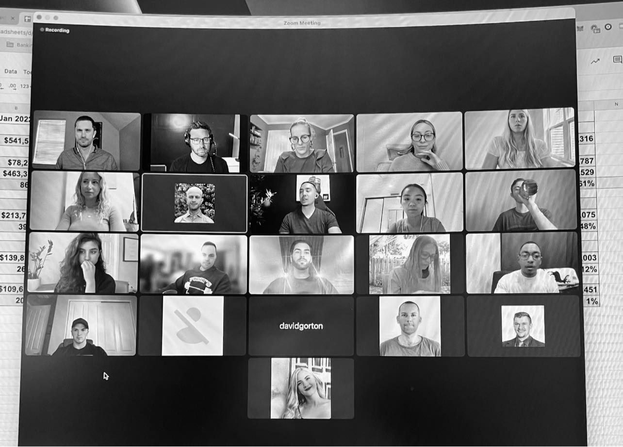A black and white photo of a group of people on a video call