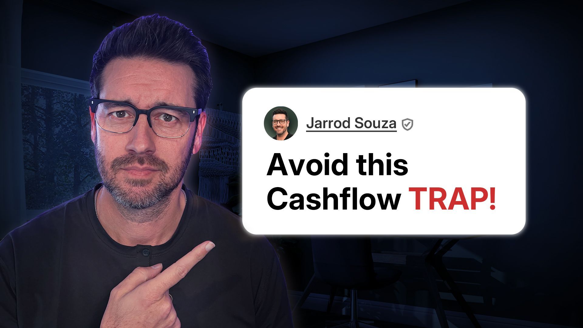 A man wearing glasses is pointing at a tweet that says `` avoid this cashflow trap ! ''