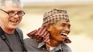 Cambodia farmer laughing in SVC tour website