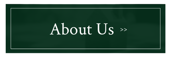 Dark green “About Us” button with white text and double angle arrows