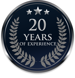 20-year experience badge with silver stars and laurel wreath on dark blue background