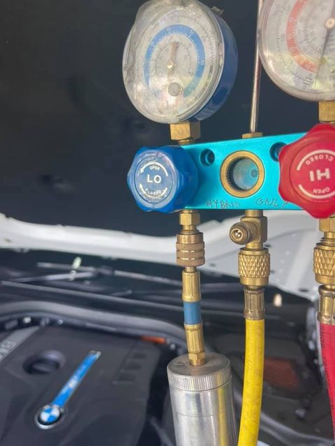 A Bunch of Gauges Are Sitting on Top of a Car Engine — Cool Cats Auto Air in Urangan, QLD