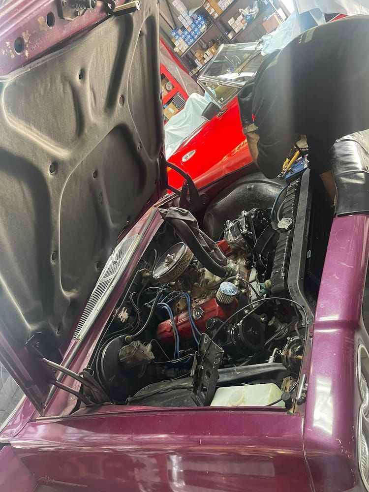 The Hood of a Purple Car is Open and the Engine is Visible — Cool Cats Auto Air in Urangan, QLD